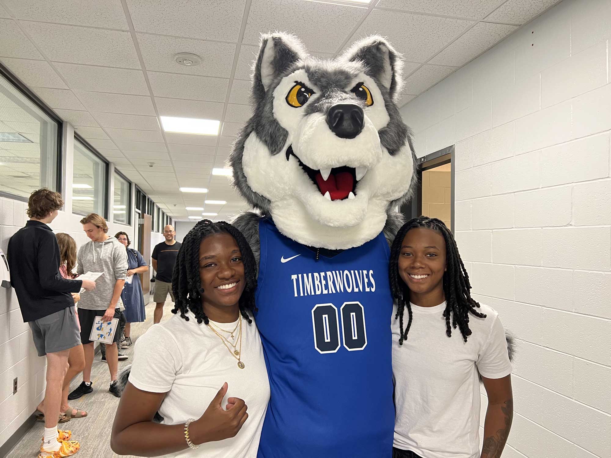 69 Students standing with Timberwolf Mascot